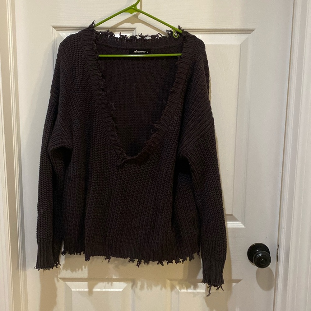 Frayed grey sweater